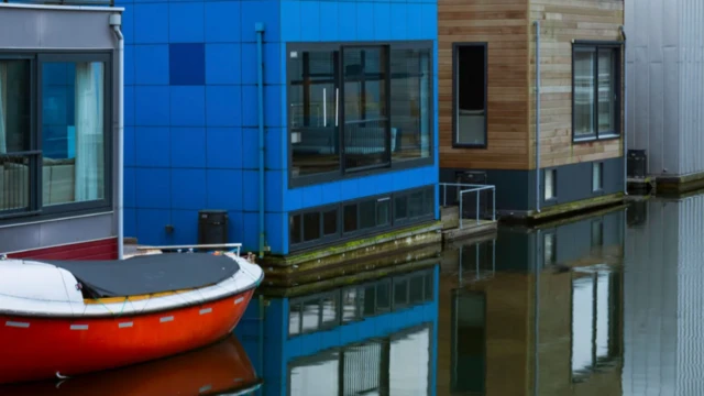 The Netherlands' floating houses are attached to a pillar, and can bob up and down the pillar according to the water level
