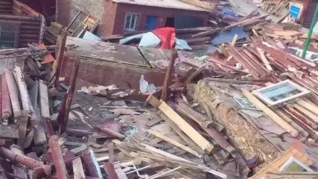 Destroyed log cabins
