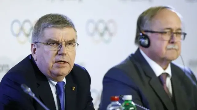 Эл аралык Олимпиада комитетинин президенти Томас Бах и комиссиянын башчысы Самуэль Шмид