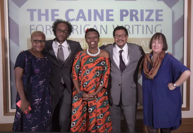 Makena Onjerika with the 2018 Caine Prize Judges