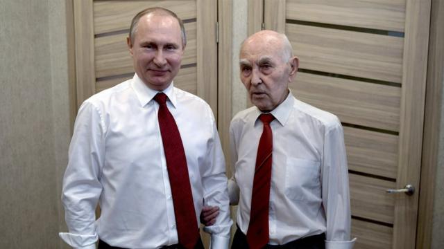 Russian President Vladimir Putin (L) poses for a photo with former head of the KGB intelligence group in Dresden Lazar Matveev (R) as he visits him at his flat in Moscow"s residential district of Zhulebino, Russia, 08 May 2017. The Russian President congratulated his former supervisor on his 90th birthday. EPA/ALEXEI NIKOLSKY/SPUTNIK/KREMLIN / POOL MANDATORY CREDIT