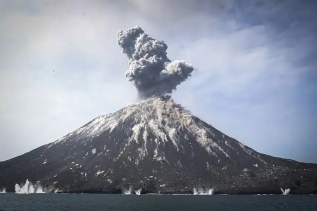 A plume of ash erupts from Mount Anak Krakatau volcano as seen from Rakata Island in Lampung province, Indonesia, 18 July 2018