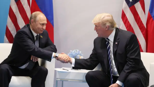 US President Donald Trump and Russia"s President Vladimir Putin shaking hands during a meeting on the sidelines of the G20 Summit in Hamburg, Germany, on July 7, 2017.