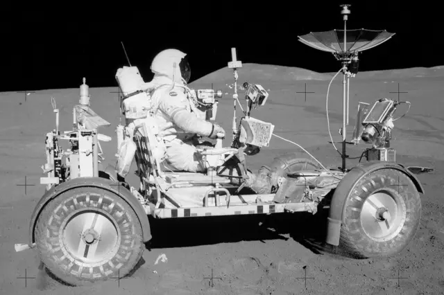 Astronaut Dave Scott in Moon buggy on the moon's surface