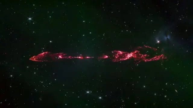 Energetic jets from a baby star light up molecular hydrogen which appears pink