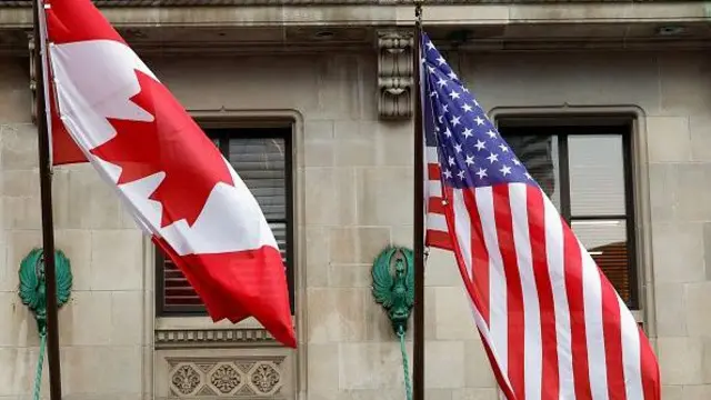 Прапори Канади та США, вивішені на будівлі 