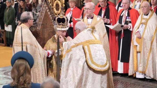 King Charles III receives The St Edward's Crown during his coronation ceremony in Westminster Abbey, London