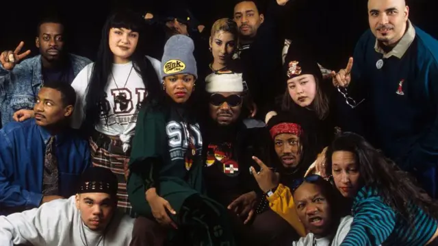 Afrika Bambaataa poses with members of the Zulu Nation crew 
