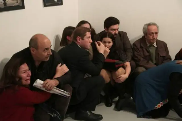 People desperately sought cover inb the immediate aftermath of the shooting