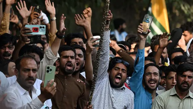Awami Action Committee (AAC) activists shout slogans during a demonstration in Muzaffarabad, capital of Pakistan-administered Kashmir on October 1, 2025, demanding structural reforms and political and economic rights.