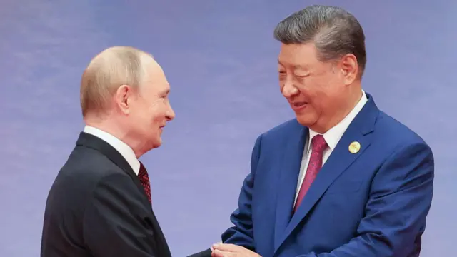 普京与习近平握手