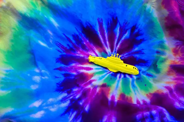 A submarine on top of tie dye