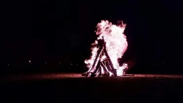 A large and controlled outdoor fire, used either for informal disposal of burnable waste material or as part of a celebration