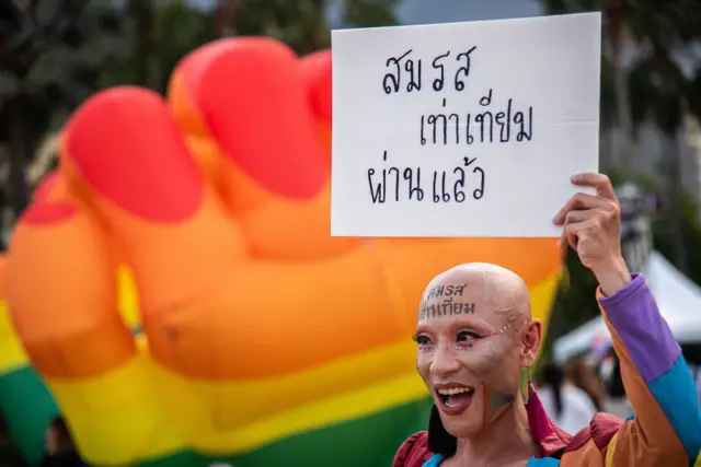 BANGKOK, THAILAND - 2024/06/18: A participant holds up a placard that says 