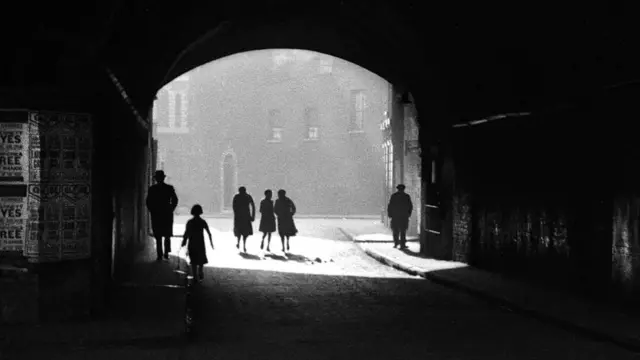 Figures in a tunnel, East End of London, 1949