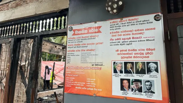 ගිනි ගැනීමට ලක්වූ 'සෙනෙහසේ කැදල්ල' රැඳවුම් මධ්‍යස්ථානයේ බිත්තියක අලවා තිබු මානසික රෝග සම්බන්ධයෙන් කරුණු ඇතුලත් පෝස්ටරයක්.