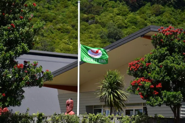 A flag in Whakatane flies at half mast