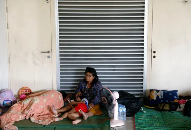 Mandatory Credit: Photo by RUNGROJ YONGRIT/EPA/Shutterstock (16058803c)
A Thai woman and a child who fled their home following clashes between Thai and Cambodian troops rest at an evacuation center in Surin province, Thailand, 09 December 2025. More than 500,000 villagers in the multiple border area have been evacuated following the clashes between Thai and Cambodian troops over the two countries border dispute. According to a statement from the Royal Thai Army, tensions at the Thai-Cambodian border have continued to rise following a clash between Thai and Cambodian troops that resulted in the deaths of three Thai soldiers and the injuries of 28.
Thai and Cambodian troops clash over the border dispute, Surin, Thailand - 09 Dec 2025