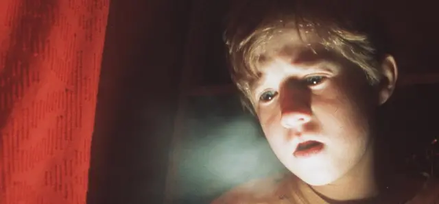 Frightened By His Paranormal Powers, 8-Year-Old Cole Sear (Haley Joel Osment) Is Too Young To Understand His Purpose In "The Sixth Sense."