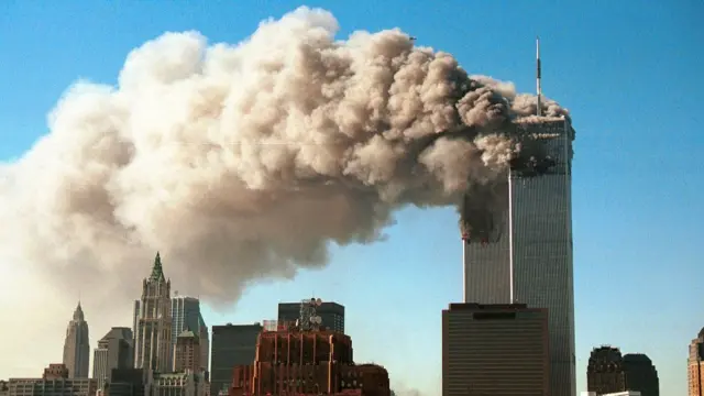Smoke pours from the twin towers of the World Trade Center after they were hit by two hijacked airliners in a terrorist attack September 11, 2001 in New York City.