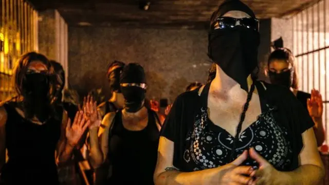 Campaigners highlighting Brazil's problem of violence towards women are pictured protesting against Bruno's return to football