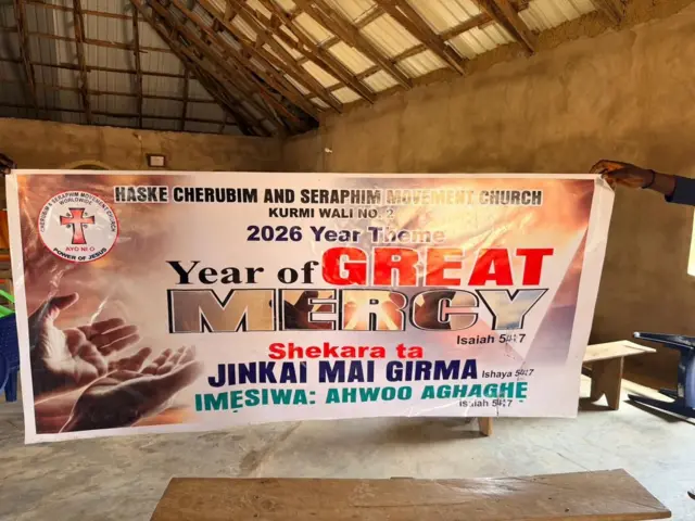  A banner that reads: 2026 - Year of great mercy inside the church where members of the congregation were abducted in Kaduna