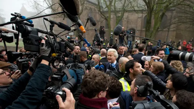 Firebrand anti-Islam lawmaker Geert Wilders, center, talks to the media during an election campaign stop in Spijkenisse, near Rotterdam, Netherlands, Saturday Feb. 18, 2017