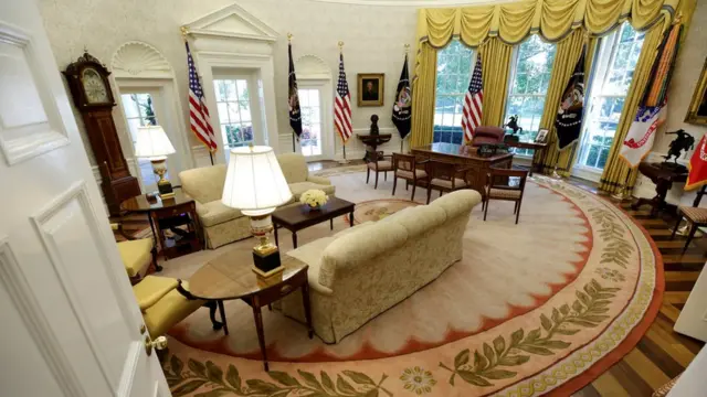 Pictured after refurbishment, the Oval Office has new, white, wallpaper.