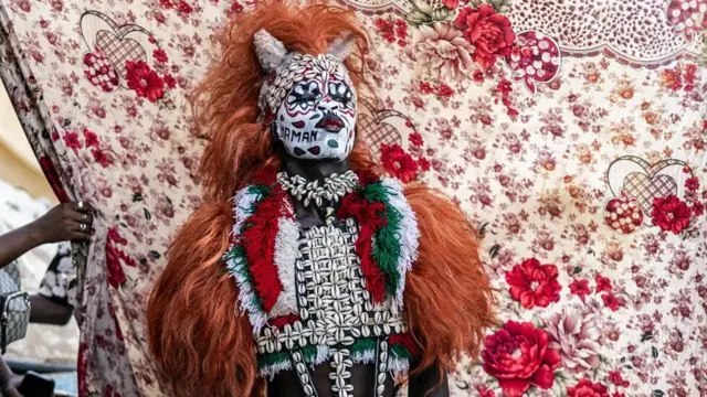 A performer in Senegal's famous Fake Lion beach entertainment show