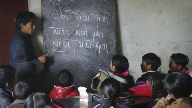 Tibetan students attend a Tibetan language class at the Wanquan Primary School at the Yanshiping Township on July 7, 2006 in Yanshiping Township, Amdo County of Tibetan Autonomous Region, China.