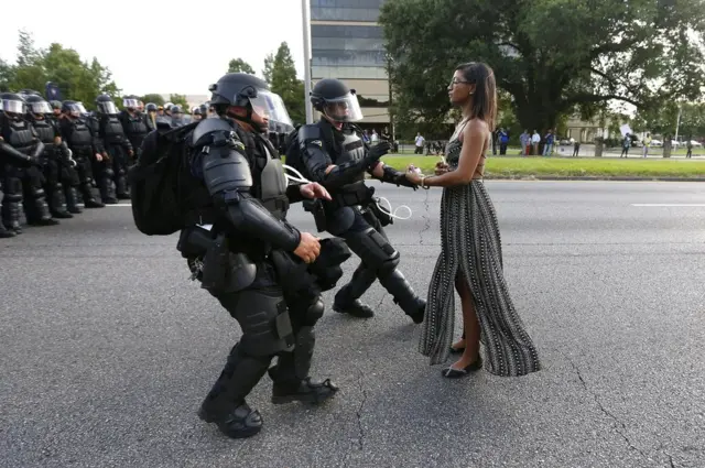 A demonstrator protesting the shooting death of Alton Sterling is detained by law enforcement near the headquarters of the Baton Rouge Police Department in Baton Rouge, Louisiana, USA, 9 July 2016.