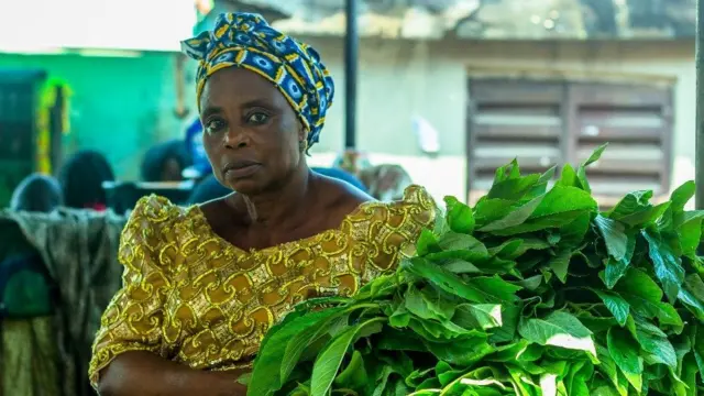 Woman hold vegetable for market