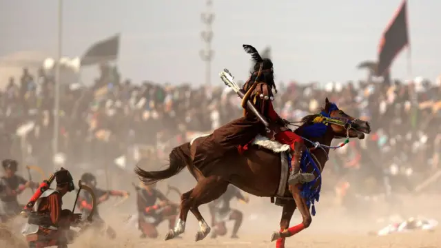 Iraqi Shiite Muslim actors reenact the Battle of Karbala on the tenth day of the mourning month of Muharram which marks the peak of Ashura, in the town of Suq al-Shuyoukh, in Dhi Qar province, on August 30, 2020. (Photo by Hussein Faleh / AFP) (Photo by HUSSEIN FALEH/AFP via Getty Images)