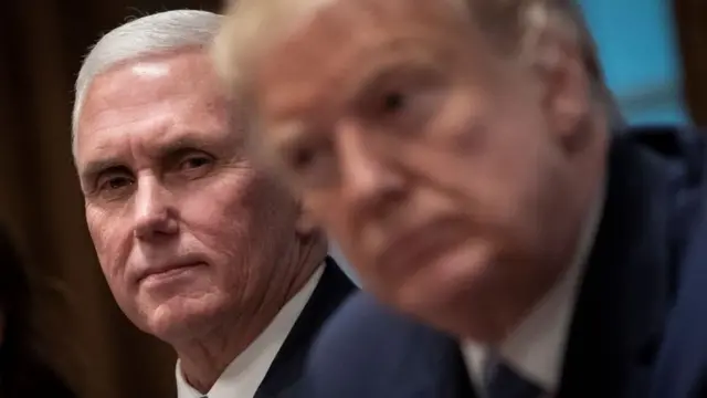 U.S. Vice President Mike Pence and U.S. President Donald Trump listen during a meeting about the Governors Initiative on Regulatory Innovation in the Cabinet Room of the White House on December 16, 2019 in Washington, DC.
