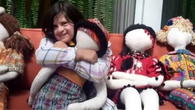 Isabella picks colourful textiles from the markets in her home country, Guatemala