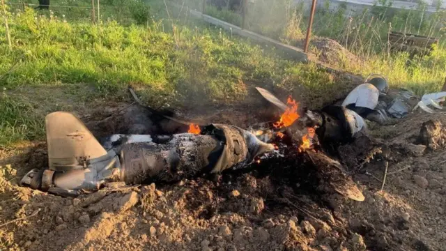 A Russian cruise missile shot down by Ukrainian Air Defence Forces is seen in the backyard of a private house, amid Russia's attack on Ukraine, in Kyiv region, Ukraine May 18, 2023