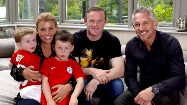 Coleen Rooney holding children Kai and Klay, with Wayne Rooney and Gary Lineker