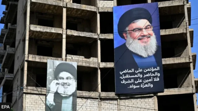 Beyrutda cümə günü İsrail hücumunda öldürülmüş Hizbullah lideri Həsən Nəsrullahın portreti asılıb
