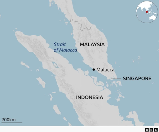 A map shows the Strait of Malacca