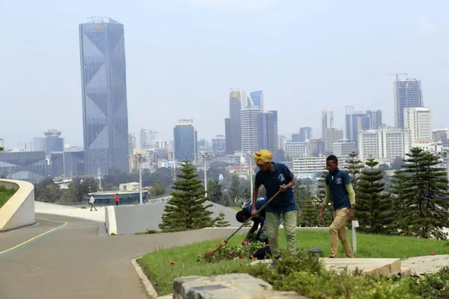 Staff tend to Friendship Park in Ethiopia's capital Addis Ababa on Tuesday, ahead of its opening.
