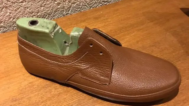 ከእሳቱ የተረፈው ከ57 ዓመት በፊት ኬጋን የሠሩት ጫማ