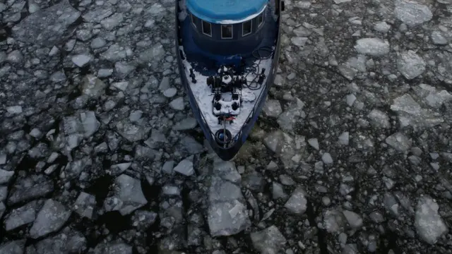 A vessel sails along the partly frozen river in Moscow, Russia
