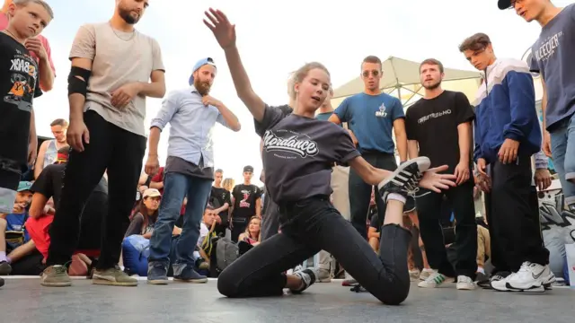 A woman breakdances at a festival in Moscow's Gorky Park