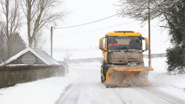 A snowplough clearing the road near Barham, Ipswich