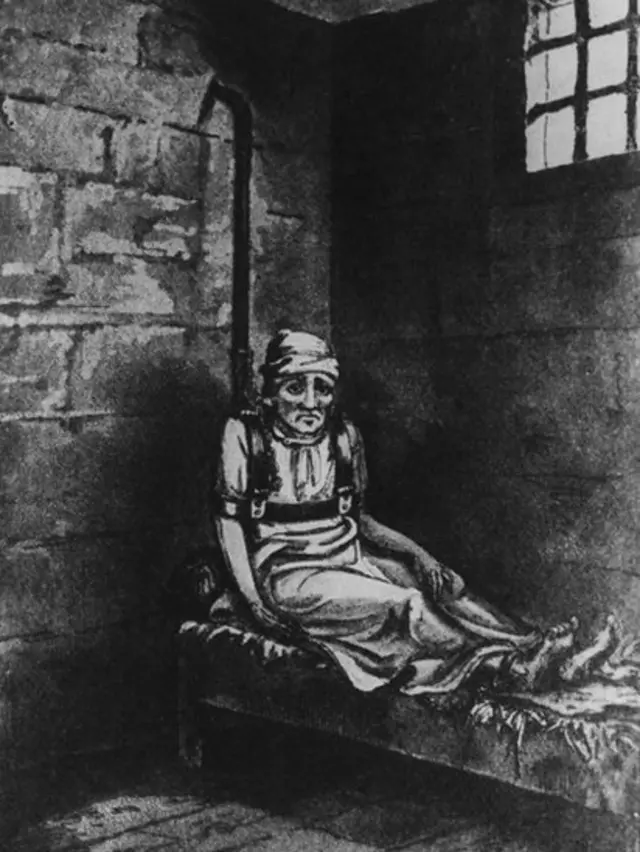 Ilustración de un paciente atado a un poste dentro de Bedlam