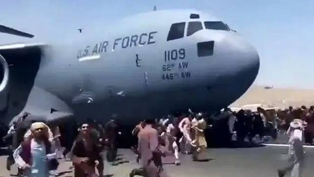 People trying to board USAF aeroplane at Kabul airport