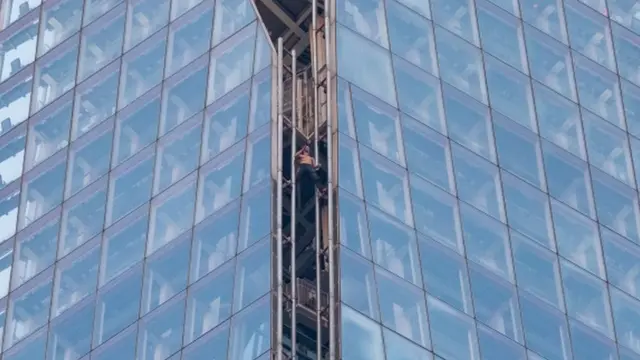 Man climbing The Shard in London