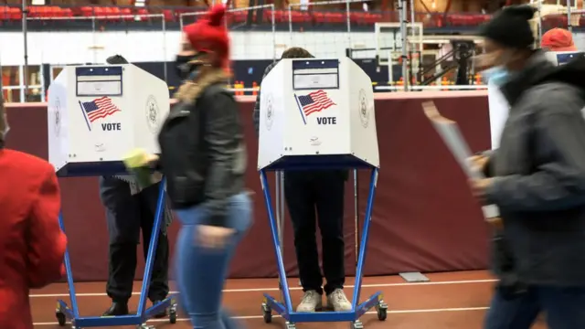 People vote at the Brooklyn Armory during early voting on October 28, 2020 in New York City