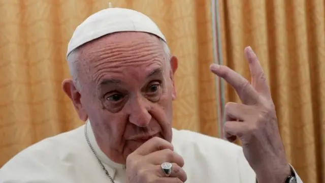 Pope Francis speaks to reporters aboard his plane. Photo: 29 April 2017