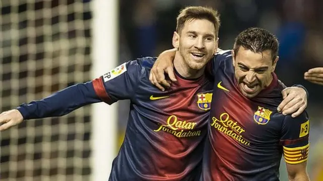 Lionel Messi and Xavi